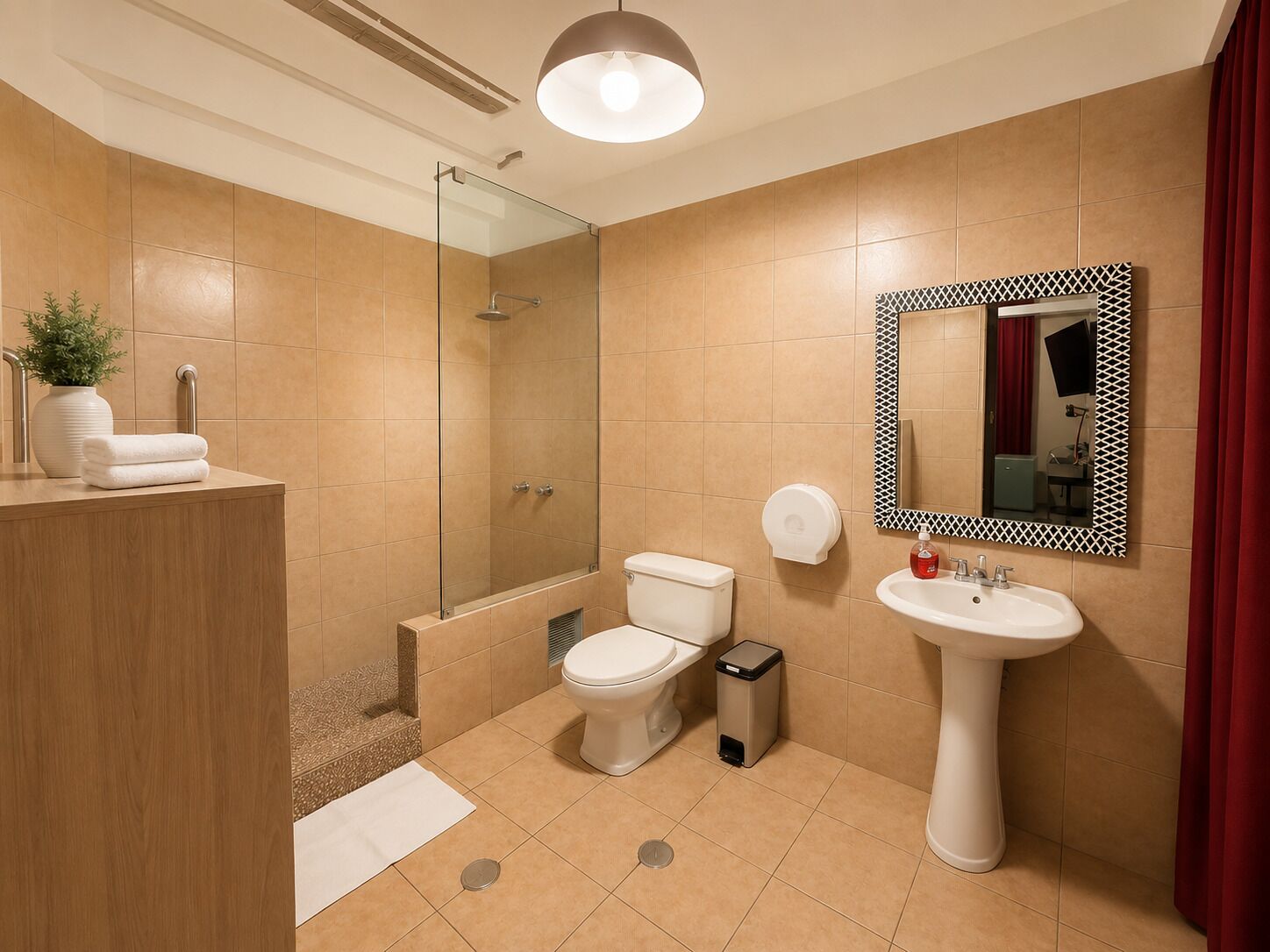 A modern bathroom with a glass shower enclosure, a toilet, a sink, and a mirror with a geometric frame.