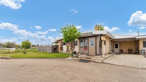 A small building with a sign labeled "OFFICE" on the front. - Ranchmen Motel (Medicine Hat)
