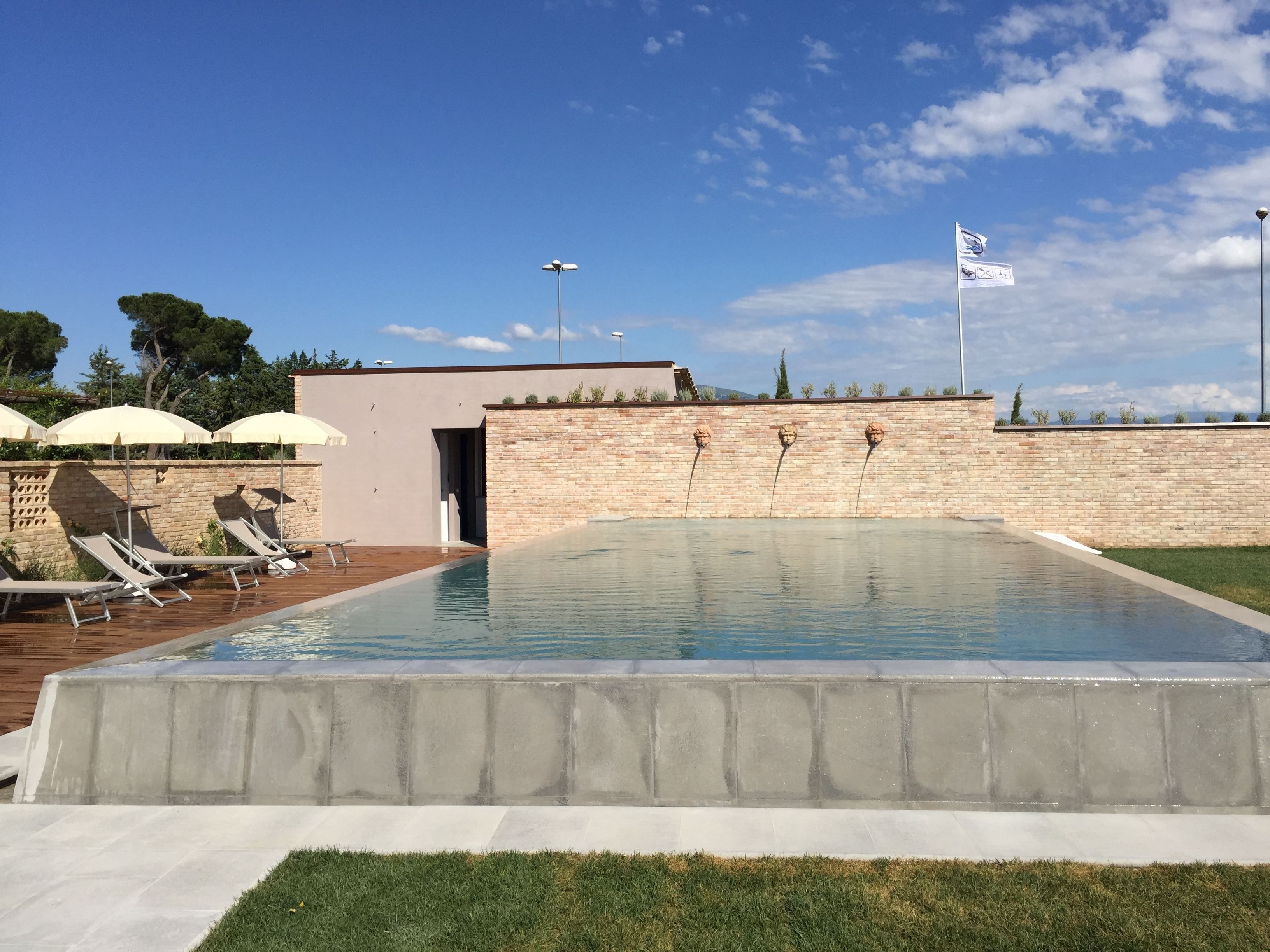 Outdoor pool, open 10:00 AM to 7:00 PM, pool umbrellas, sun loungers