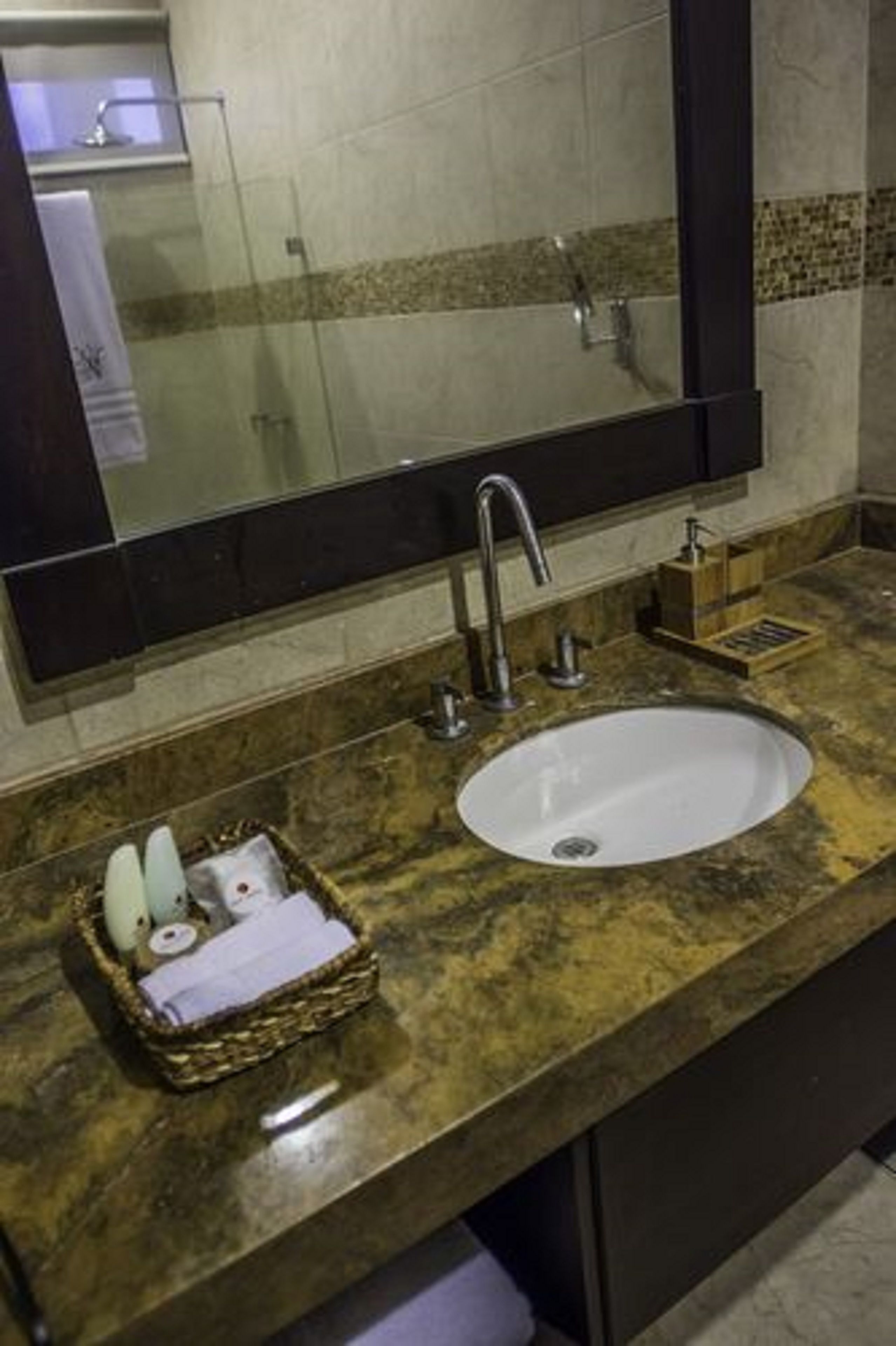 shower, rainfall showerhead, hair dryer, towels