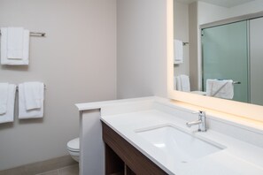 A modern bathroom with a white sink, a mirror, and a toilet. - Holiday Inn Express & Suites Ruston by IHG (Ruston)