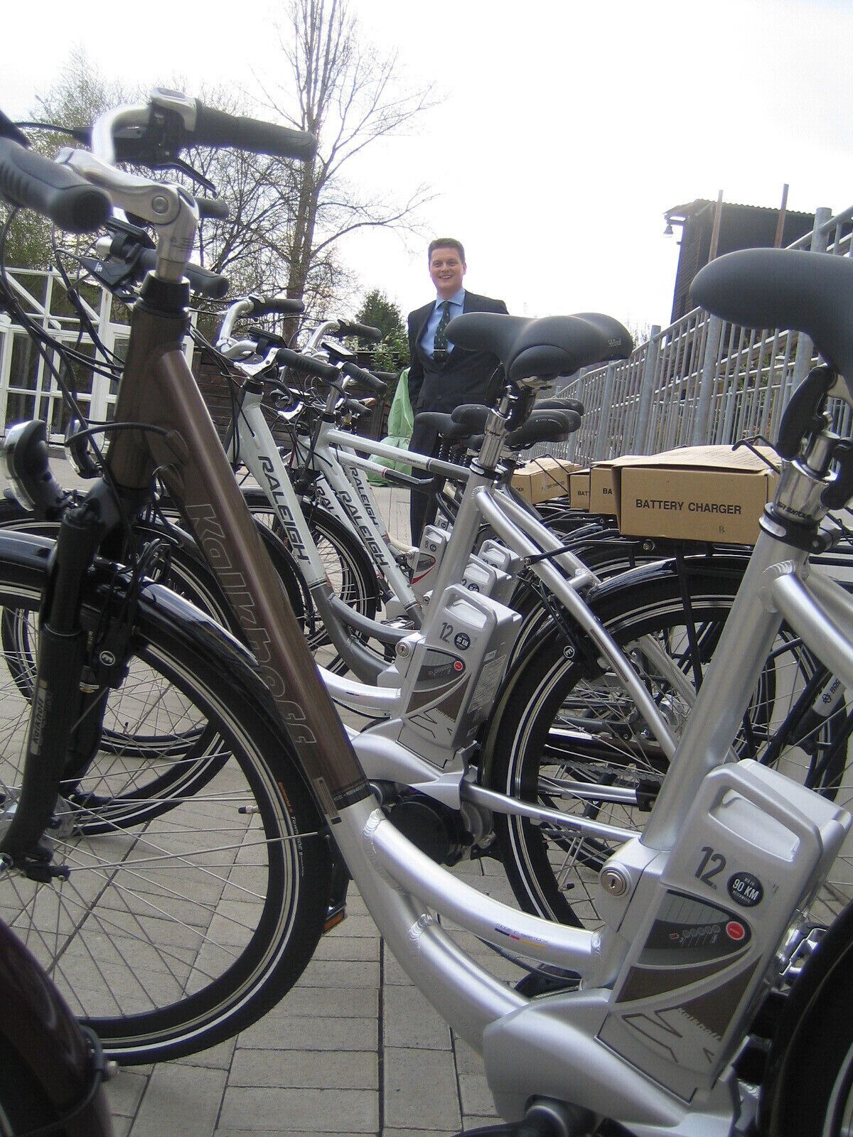 A bicycle with a battery charger attached to it.