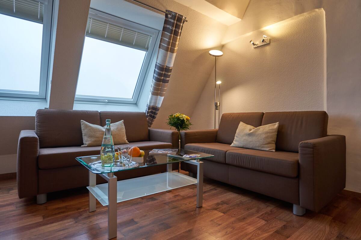 Apartment | Living area | 32-inch flat-screen TV with satellite channels, TV, heated floors