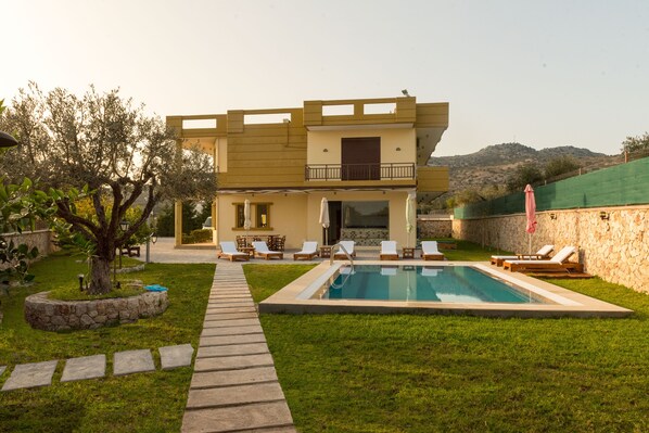 Seasonal outdoor pool, pool umbrellas, pool loungers