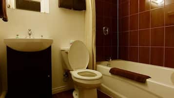 Superior Room, 2 Queen Beds | Bathroom | Combined shower/bathtub, deep-soaking bathtub, rainfall showerhead