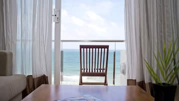 Panorama Suite with Full Sea View | Living room | 40-inch LED TV with cable channels, TV