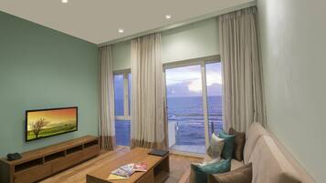 Panorama Suite with Full Sea View | Living area | 40-inch LED TV with cable channels, TV