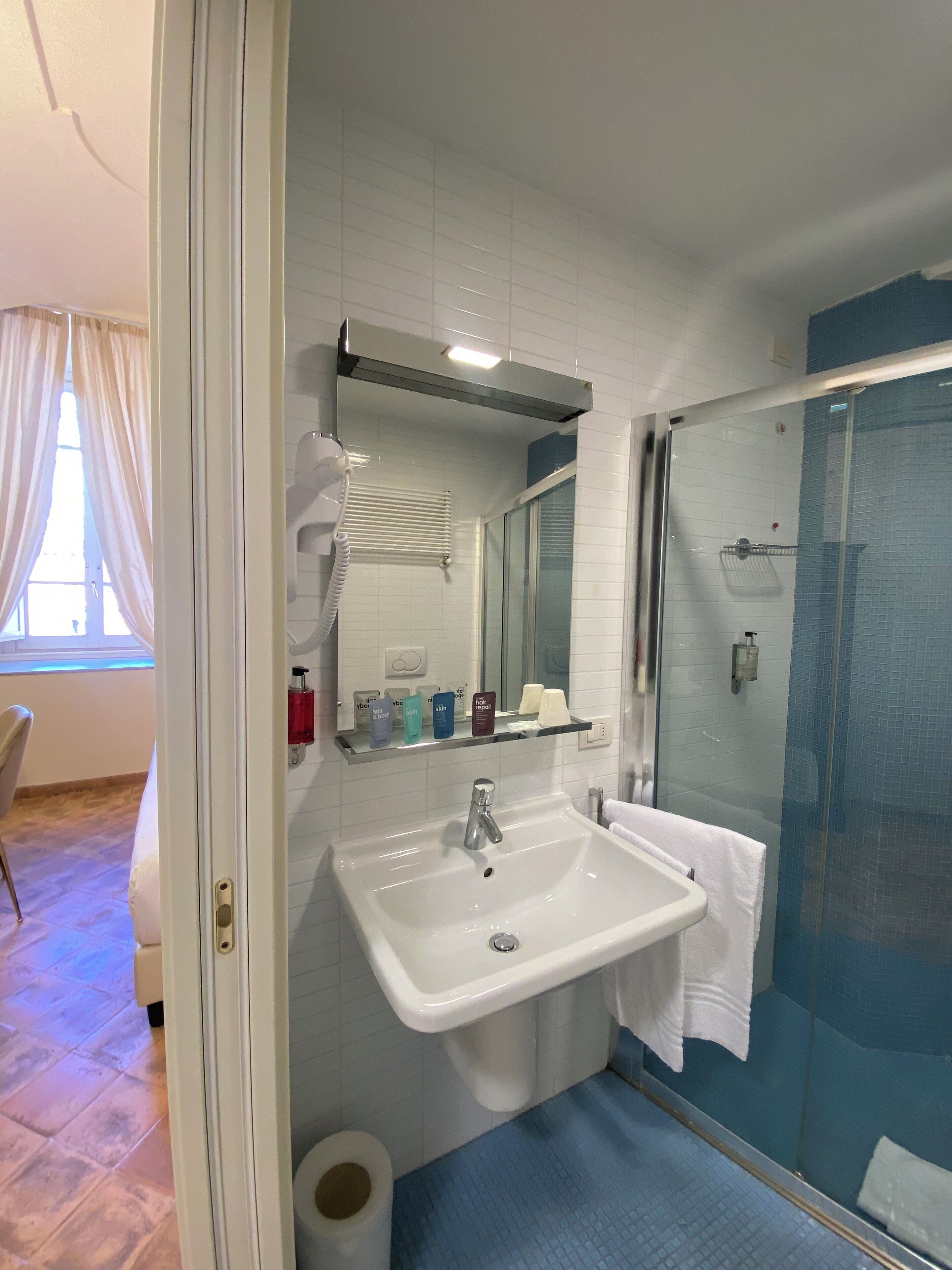 classic room | bathroom | shower, rainfall showerhead, free toiletries, hair dryer