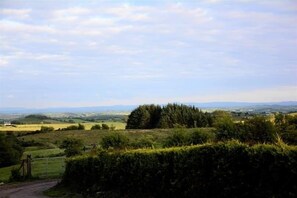 A rural landscape with a gate, hedges, and distant fields. - Crockgarve (Dungannon)