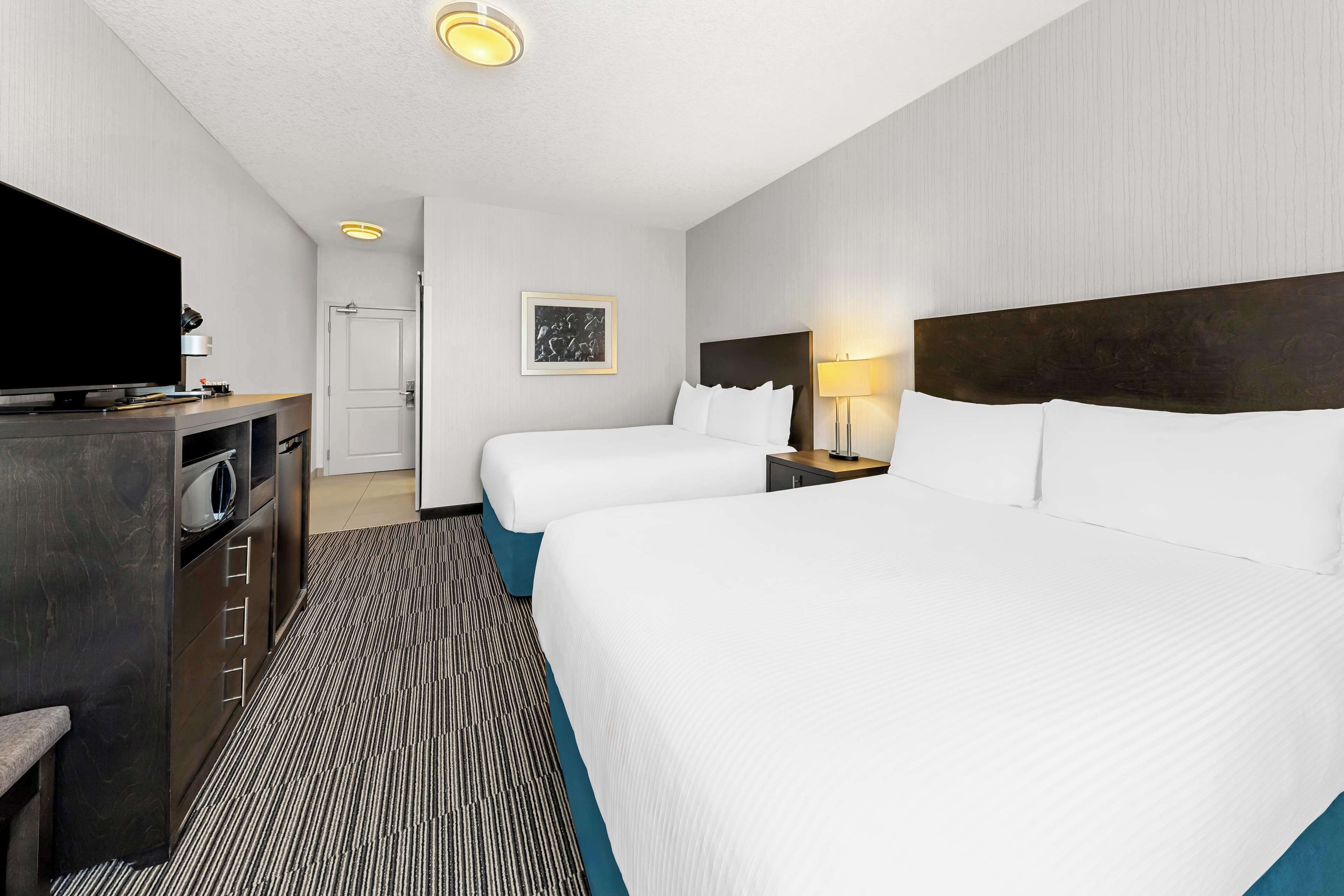Standard Room, 2 Queen Beds, Non Smoking | In-room safe, desk, iron/ironing board, cribs/infant beds