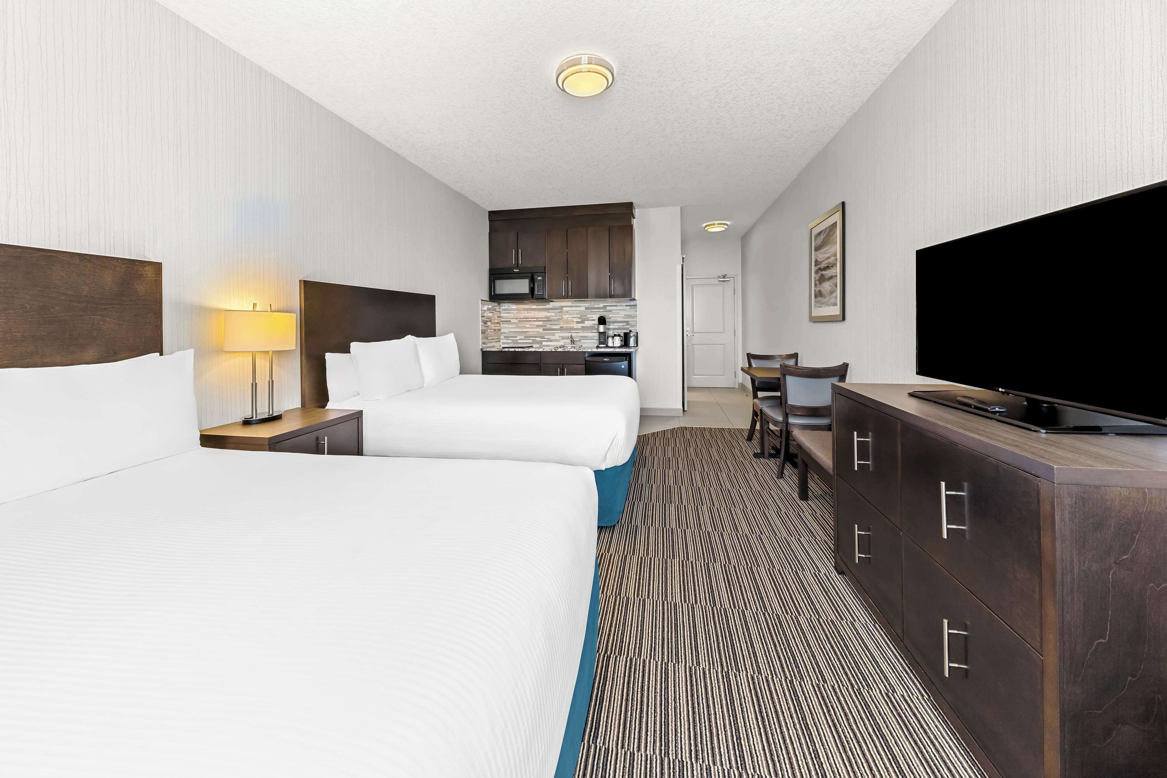 standard room, 2 queen beds, non smoking, kitchenette | 1 bedroom, in-room safe, desk, iron/ironing board