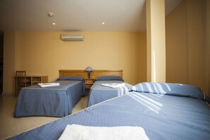 Standard Triple Room, Private Bathroom | In-room safe, desk, blackout curtains, iron/ironing board