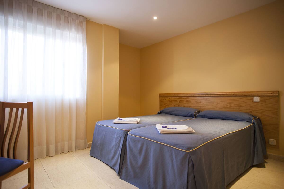Standard Twin Room, Private Bathroom | In-room safe, desk, blackout drapes, iron/ironing board (on request)