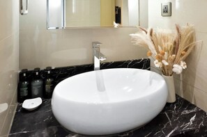 Shower, free toiletries, hair dryer, slippers