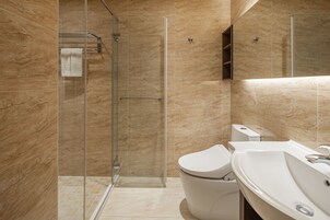 Shower, hair dryer, slippers, towels