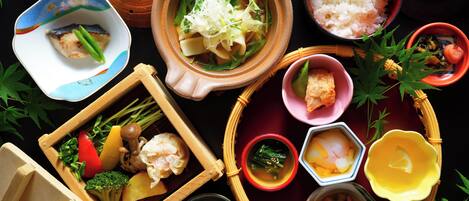 A variety of dishes and food items arranged on a table.
