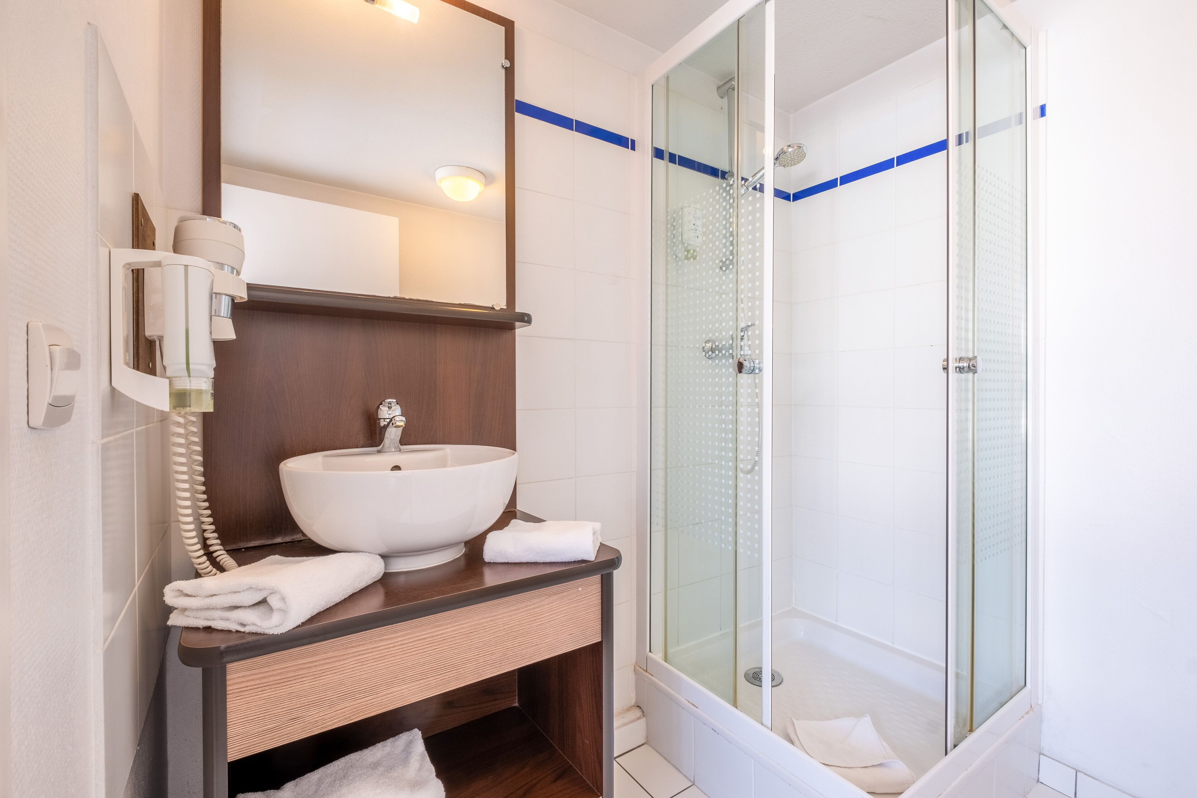 Shower, eco-friendly toiletries, hair dryer, towels