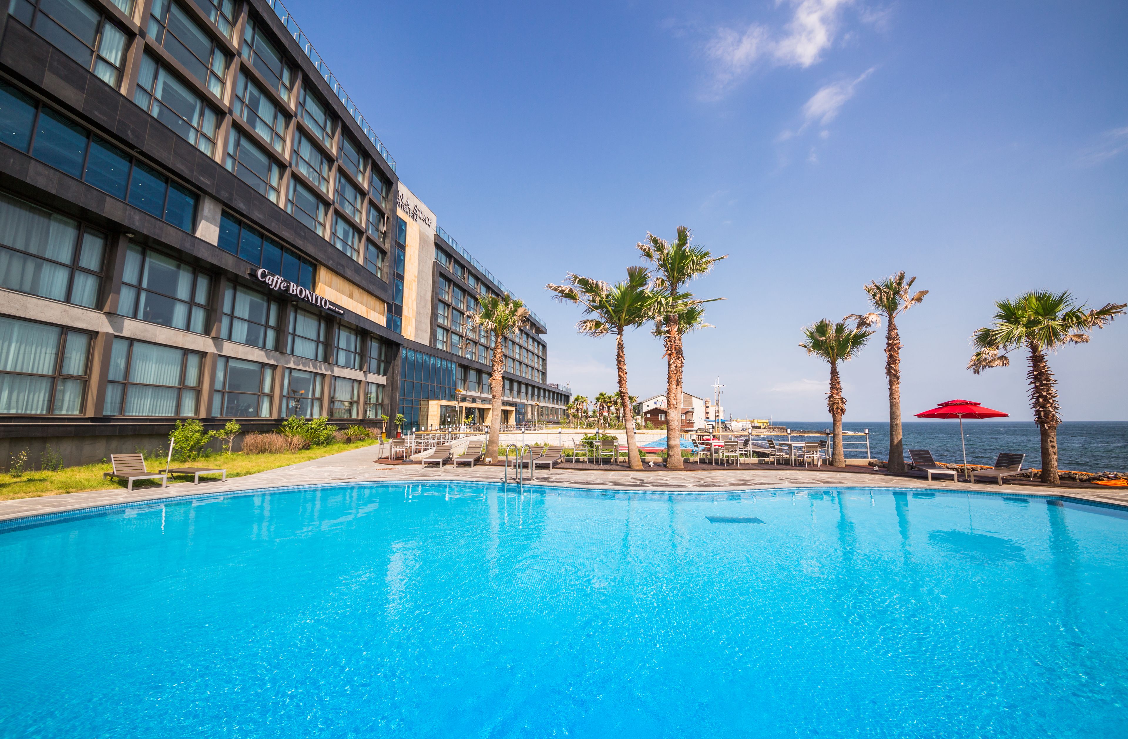 seasonal outdoor pool, open 11:00 am to 7:00 pm, pool umbrellas