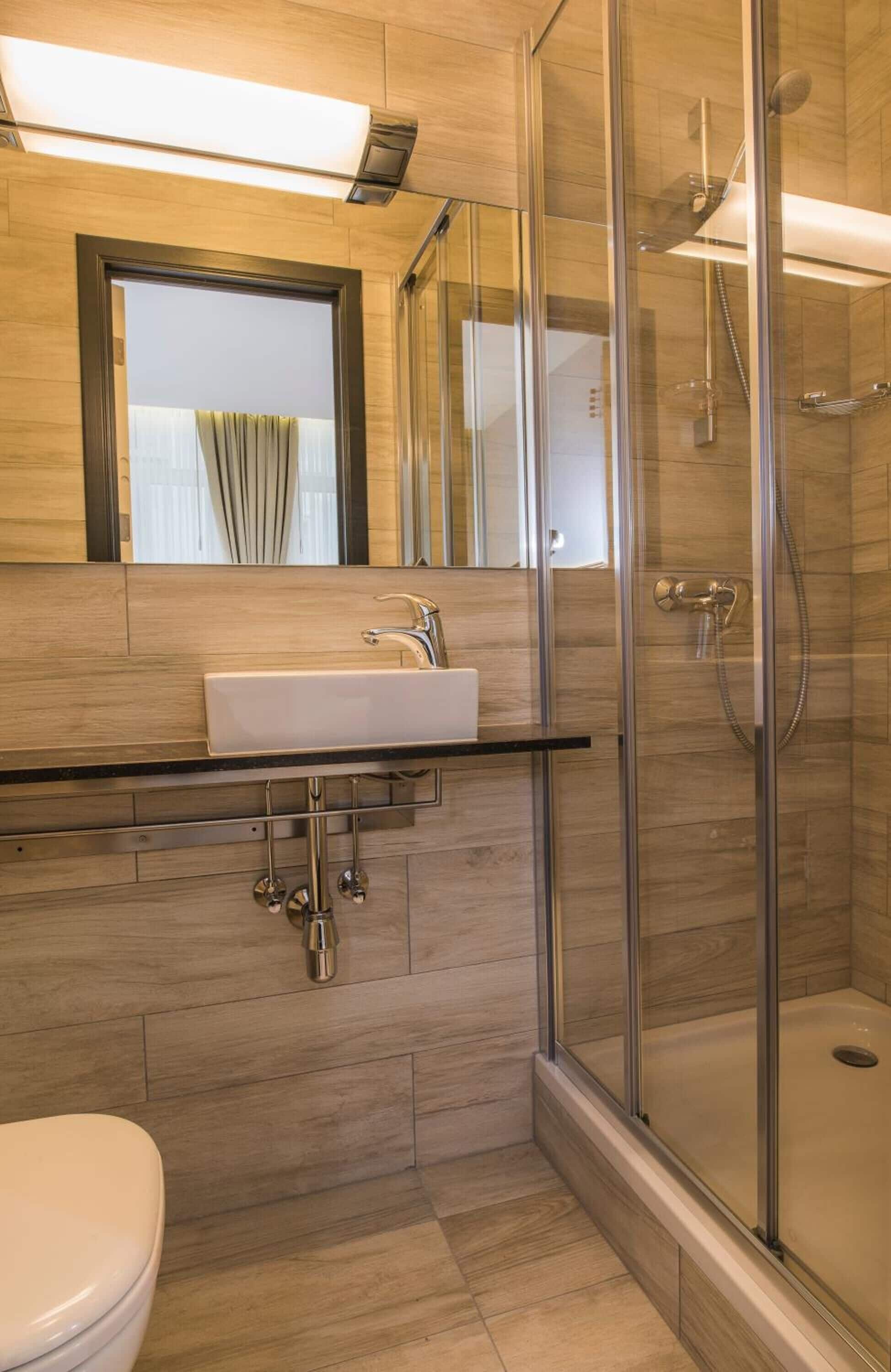 twin room | bathroom | shower, hair dryer, towels, soap