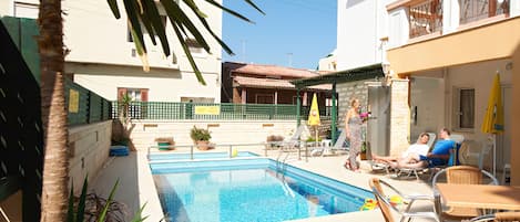 Outdoor pool, pool umbrellas, pool loungers