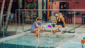 Outdoor pool, open 7:00 AM to 10:00 PM, pool umbrellas, pool loungers