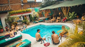 Outdoor pool, open 7:00 AM to 10:00 PM, pool umbrellas, pool loungers