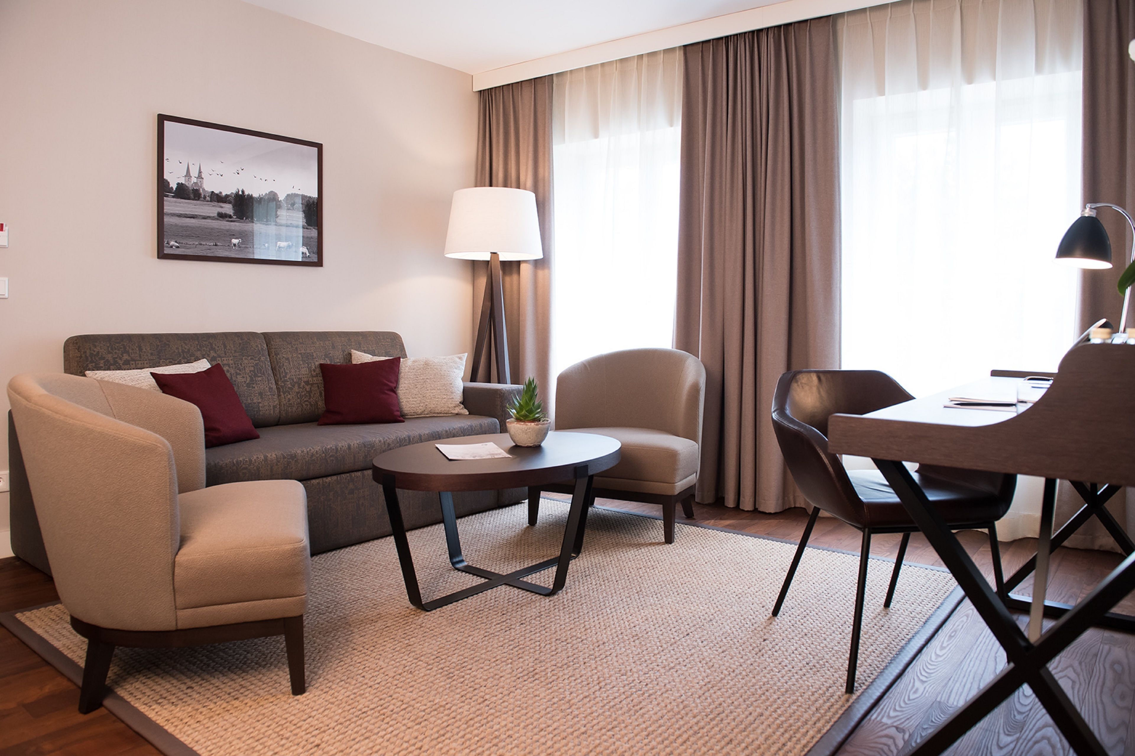 comfort double room, accessible | living room | flat-screen tv