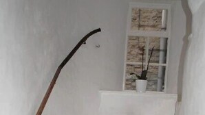 A white staircase with a wooden handrail. - Sykes's House (Leyburn)