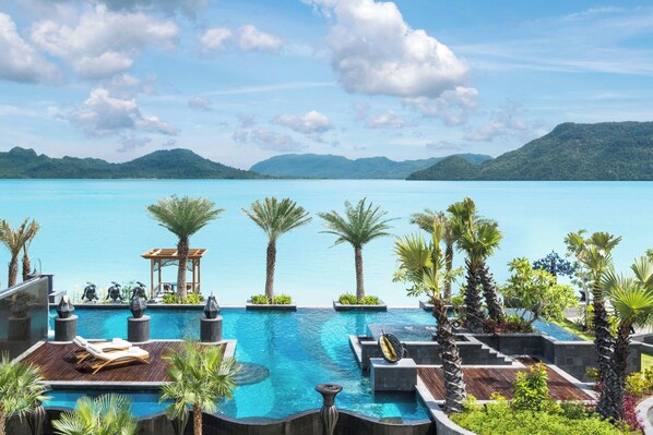 Outdoor pool, open 7:00 AM to 7:00 PM, free cabanas, pool umbrellas