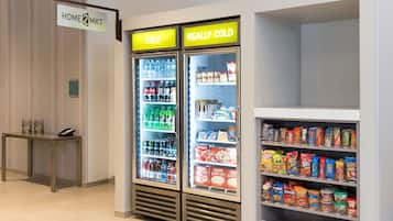 Two beverage dispensers labeled "COLD" and "REALLY COLD" in a hotel lobby.