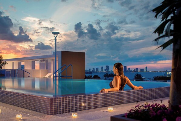 Outdoor pool, open 7:00 AM to 10:00 PM, pool loungers