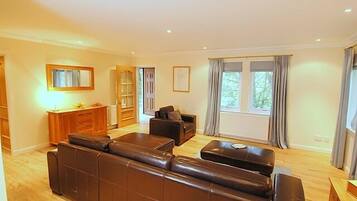 Standard Cottage, 2 Bedrooms (four poster double + bunkbed) | Living room | Flat-screen TV, DVD player