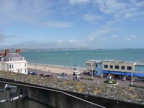 A coastal town with a beach, a pier, and a building labeled "SEA VIEW". - The Esplanade (Weymouth)