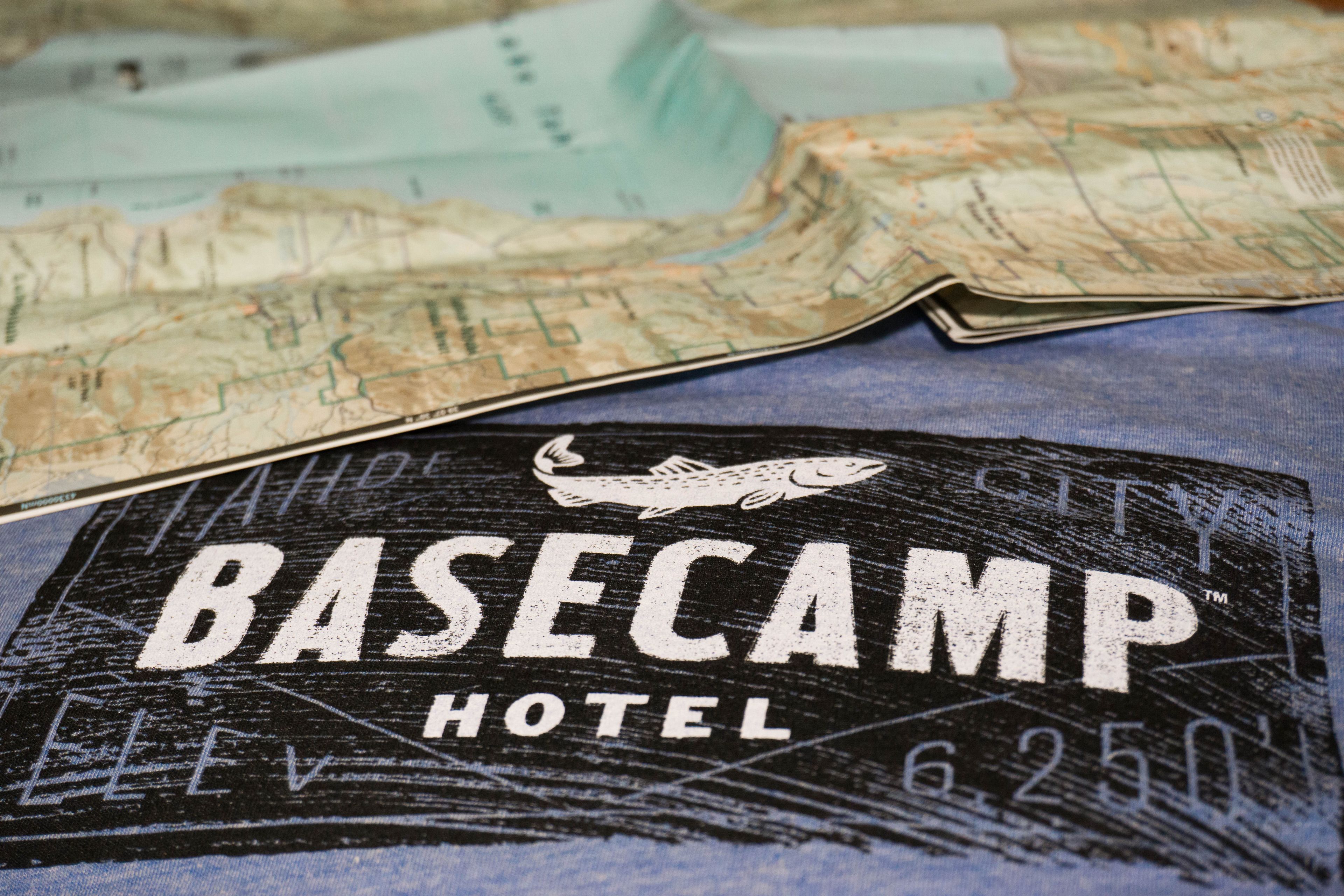 A map and a sign for the Basecamp Hotel.