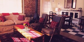 Bella Rosa Cottage | Living area | TV, fireplace - Periwinkle Grove Cottage (Clarens)