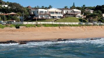 Overlooking the ocean, this hillside property offers stunning views from its spacious balcony.