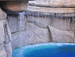 A rock formation with a cascading water feature.
