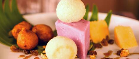 A dessert plate with various sweets and fruits.