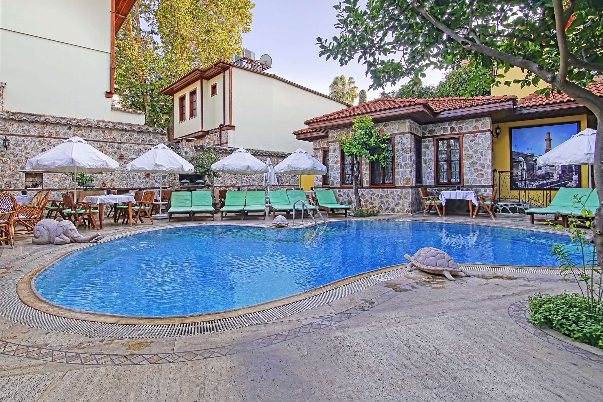 Seasonal outdoor pool, pool umbrellas, pool loungers