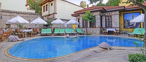 Seasonal outdoor pool, pool umbrellas, pool loungers