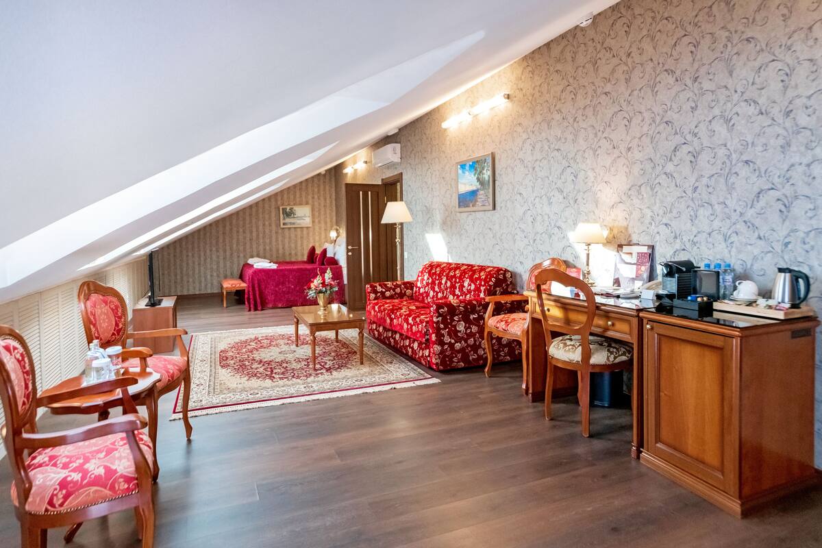 Deluxe Mansard | Free minibar items, in-room safe, desk, blackout curtains