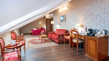 Deluxe Mansard | Free minibar items, in-room safe, desk, blackout drapes