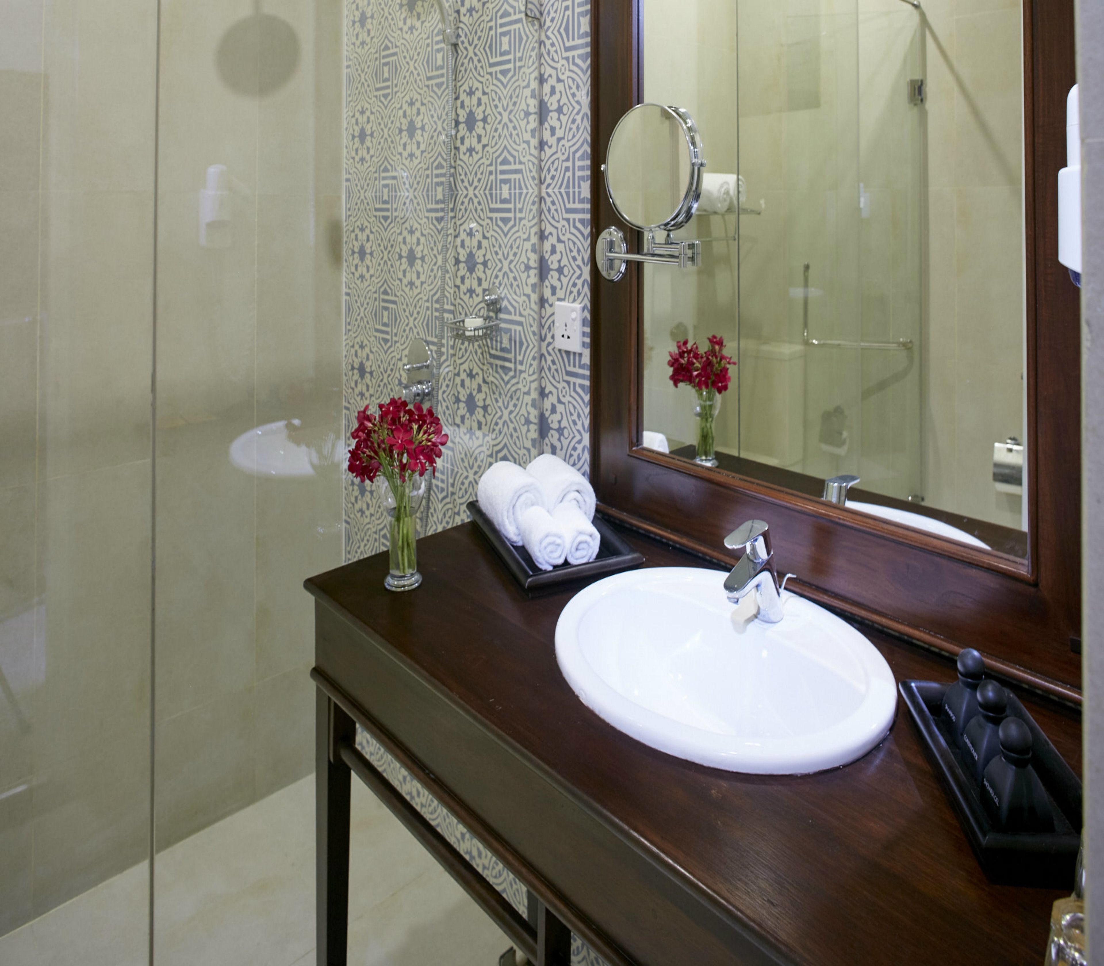 deluxe room, 1 king bed | bathroom | shower, free toiletries, hair dryer, slippers