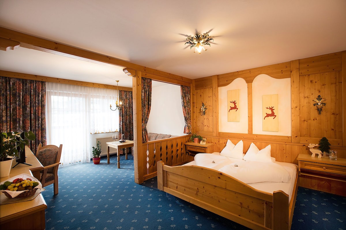 Junior Suite, Balcony, Mountain View | In-room safe, desk, free WiFi, bed sheets