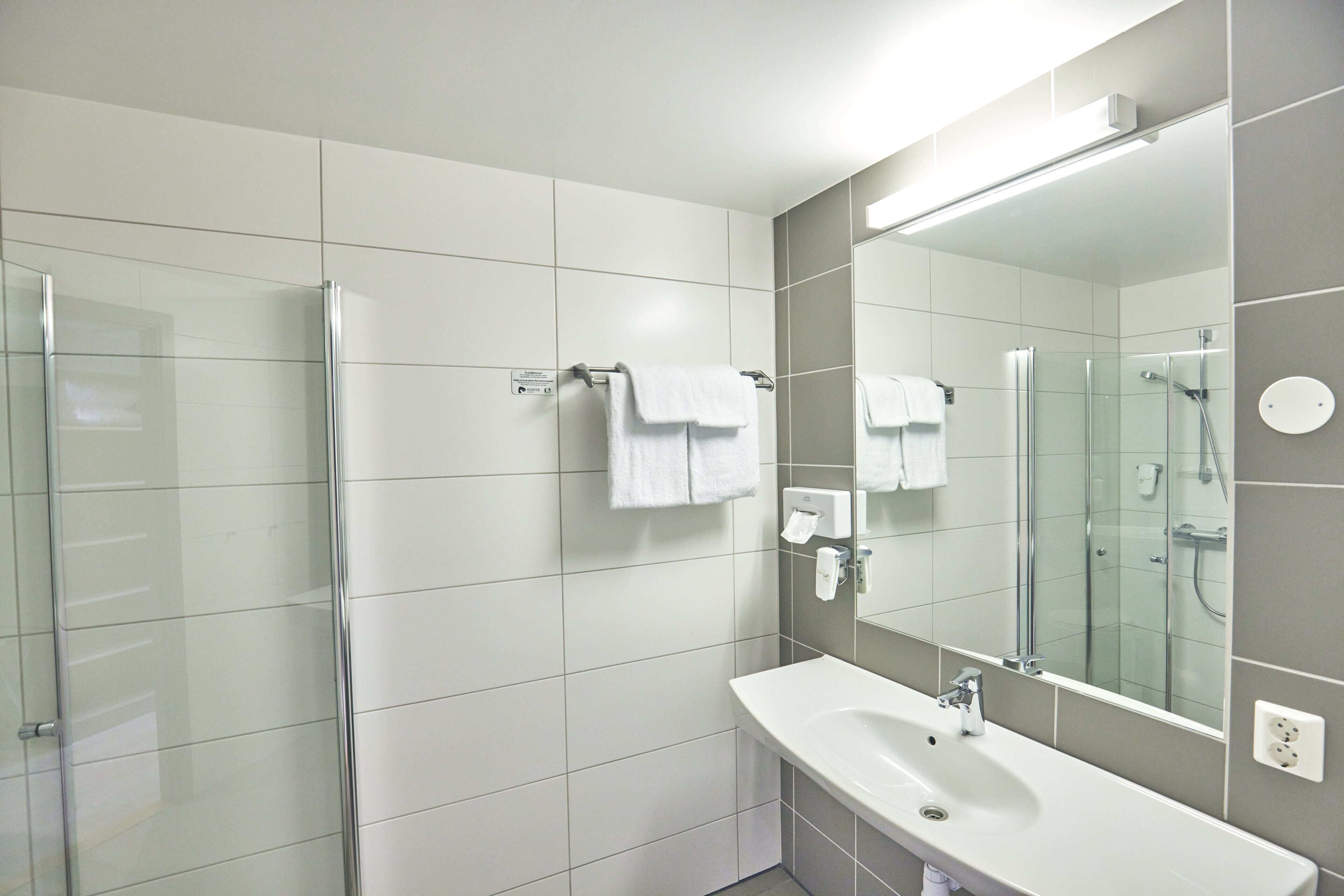 shower, eco-friendly toiletries, towels