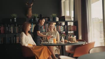 Enjoy a quiet evening in with a book and a meal for two, surrounded by a personal library and unique decor.