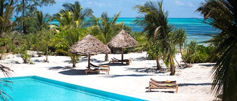 Outdoor pool, pool umbrellas, sun loungers