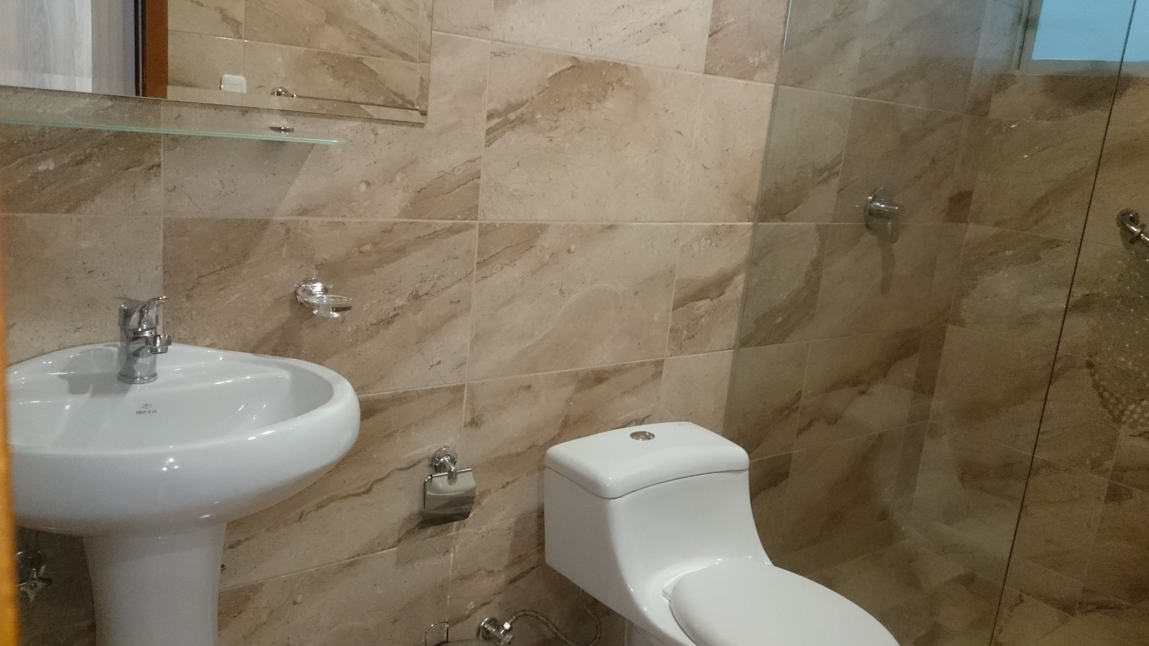 premium studio suite, 1 bedroom, refrigerator & microwave, ground floor | bathroom | shower, rainfall showerhead, designer toiletries, towels