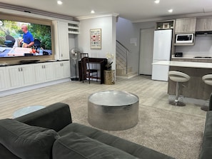 Bells and Whistles | Living area | 32-inch flat-screen TV with satellite channels, TV