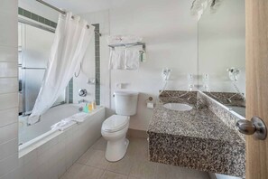 Room, 1 King Bed, Jetted Tub | Bathroom | Combined shower/tub, designer toiletries, hair dryer, bathrobes